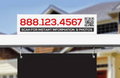 Real estate sign with contact information and QR code in front of a house.